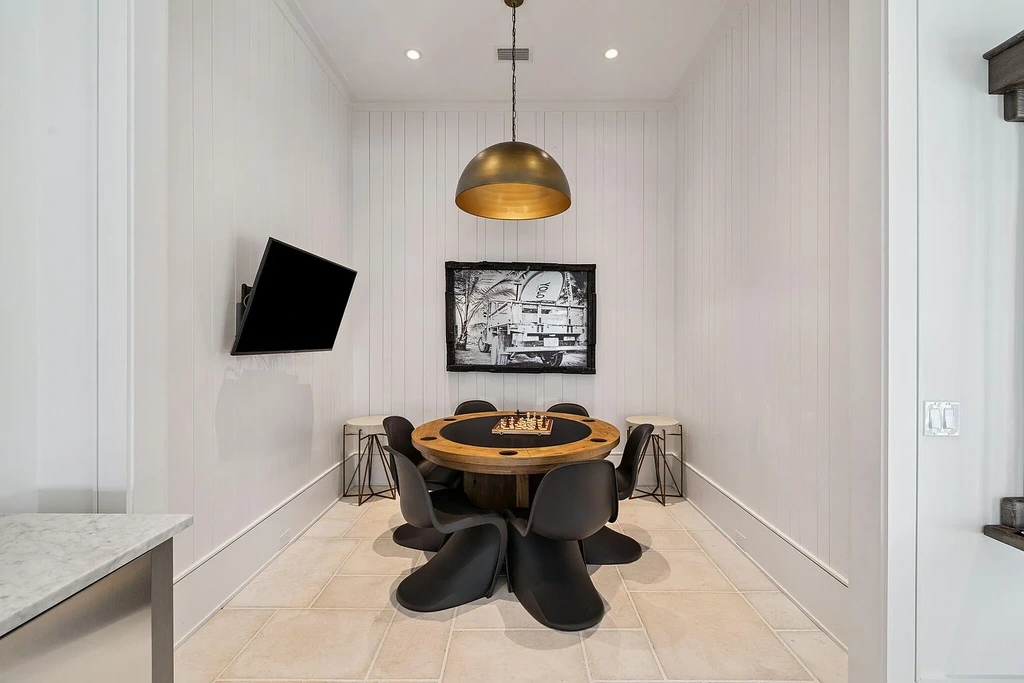 Luxury bayfront estate at 147 Ansley Forest Dr, Santa Rosa Beach, featuring private dock, pool house, 6 bedrooms, 7 bathrooms, and contemporary coastal design with panoramic water views.