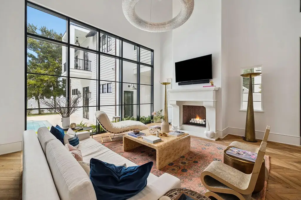 Luxury bayfront estate at 147 Ansley Forest Dr, Santa Rosa Beach, featuring private dock, pool house, 6 bedrooms, 7 bathrooms, and contemporary coastal design with panoramic water views.