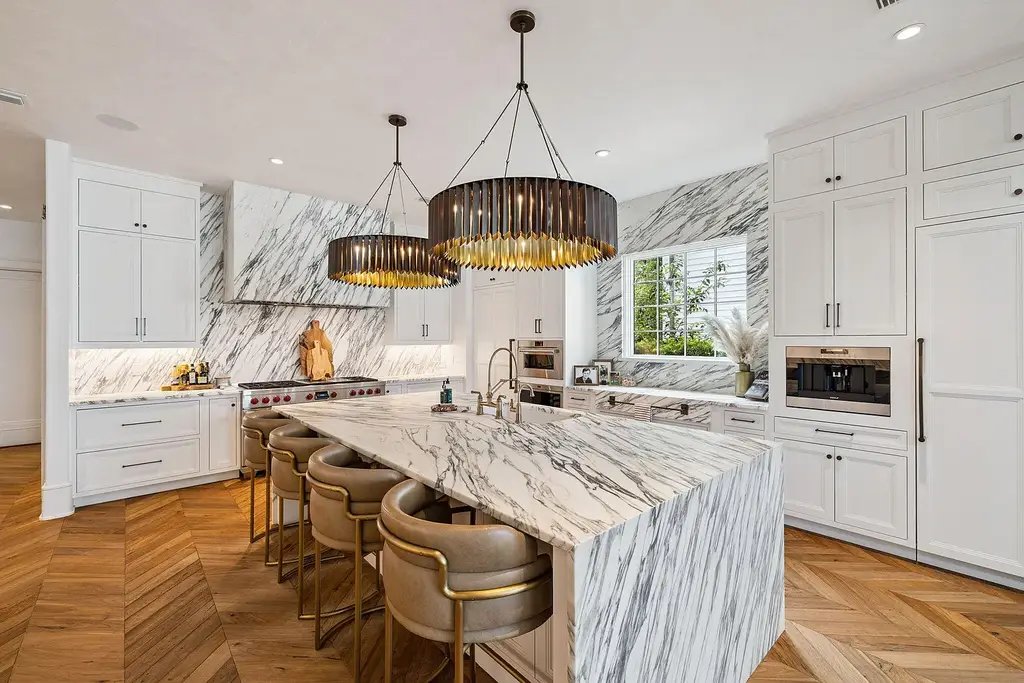 Luxury bayfront estate at 147 Ansley Forest Dr, Santa Rosa Beach, featuring private dock, pool house, 6 bedrooms, 7 bathrooms, and contemporary coastal design with panoramic water views.