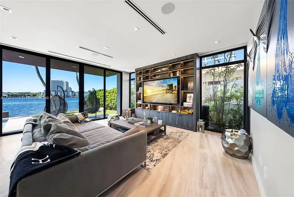 Stunning $16.9 Million Modern Waterfront Estate with Wide Maule Lake Views in North Miami Beach 8 Luxury modern waterfront home at 16470 NE 30th Ave in North Miami Beach featuring wide Maule Lake views, private dock, and sleek contemporary design.