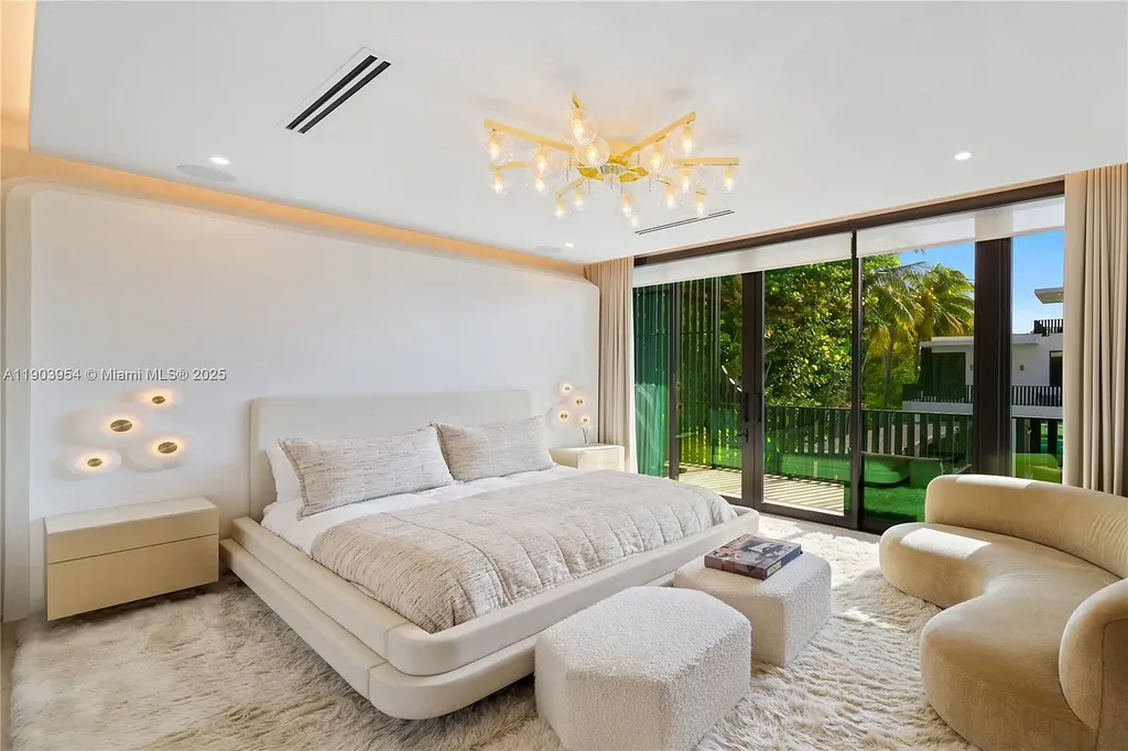 Front exterior of 2053 N Bay Rd Miami Beach modern waterfront estate with sleek architecture and tropical landscaping