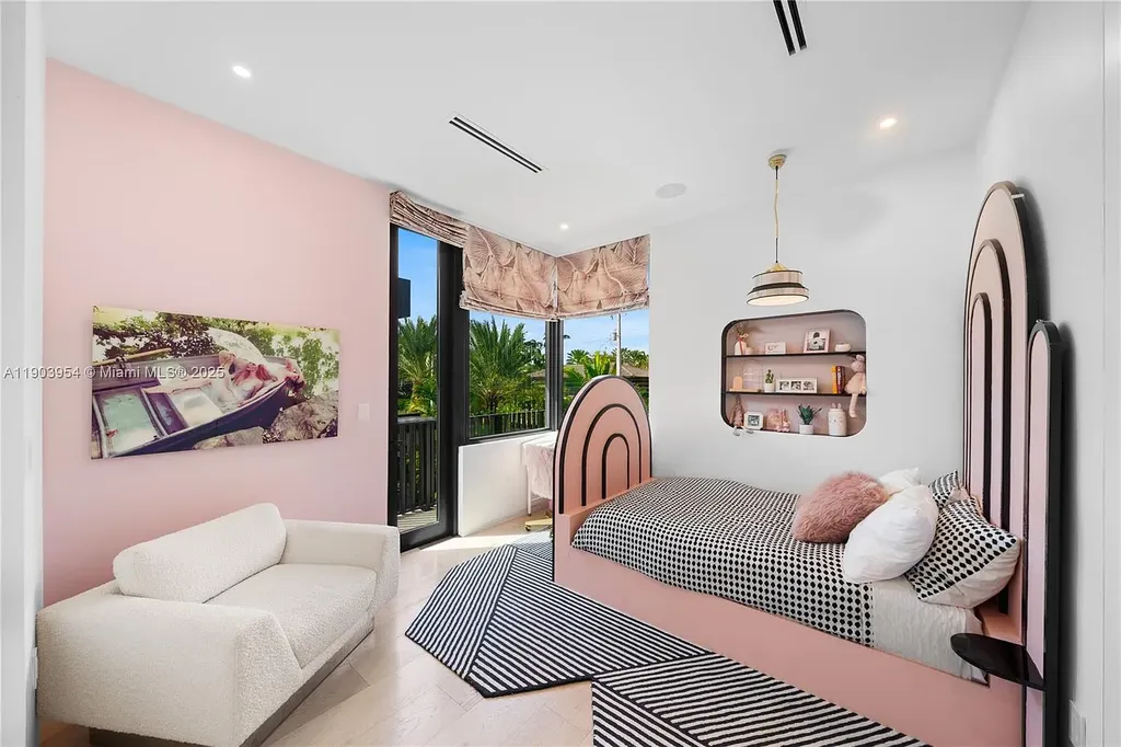 Front exterior of 2053 N Bay Rd Miami Beach modern waterfront estate with sleek architecture and tropical landscaping