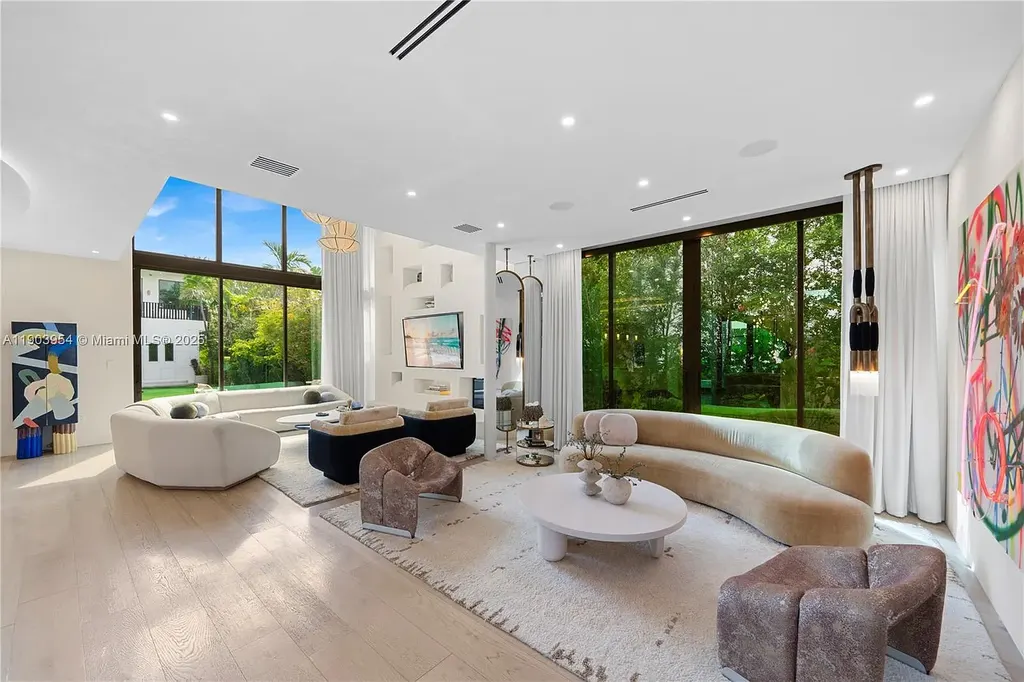 Front exterior of 2053 N Bay Rd Miami Beach modern waterfront estate with sleek architecture and tropical landscaping