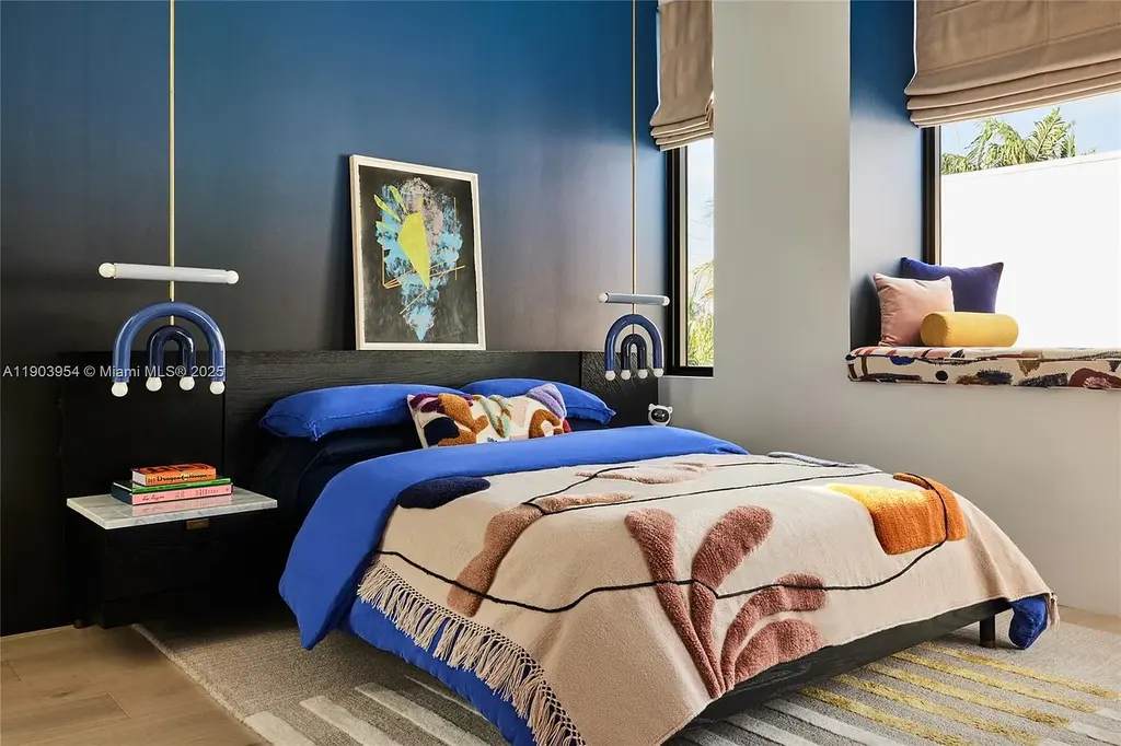 Front exterior of 2053 N Bay Rd Miami Beach modern waterfront estate with sleek architecture and tropical landscaping