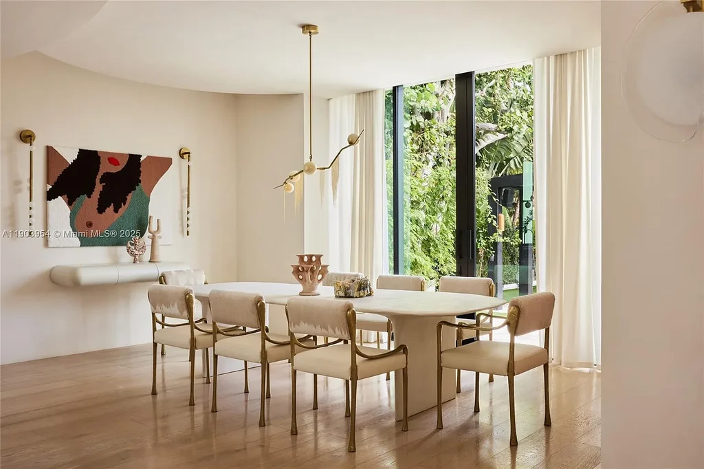 Front exterior of 2053 N Bay Rd Miami Beach modern waterfront estate with sleek architecture and tropical landscaping