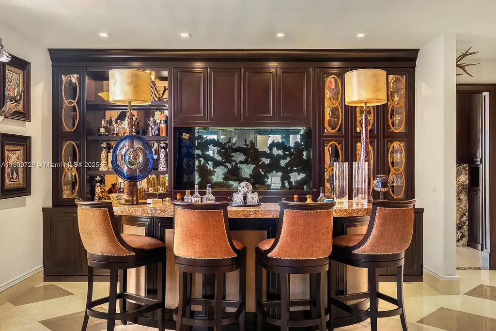 Luxury waterfront estate at 210 Palm Ave Miami Beach with infinity pool, private dock, modern finishes, and panoramic bay views