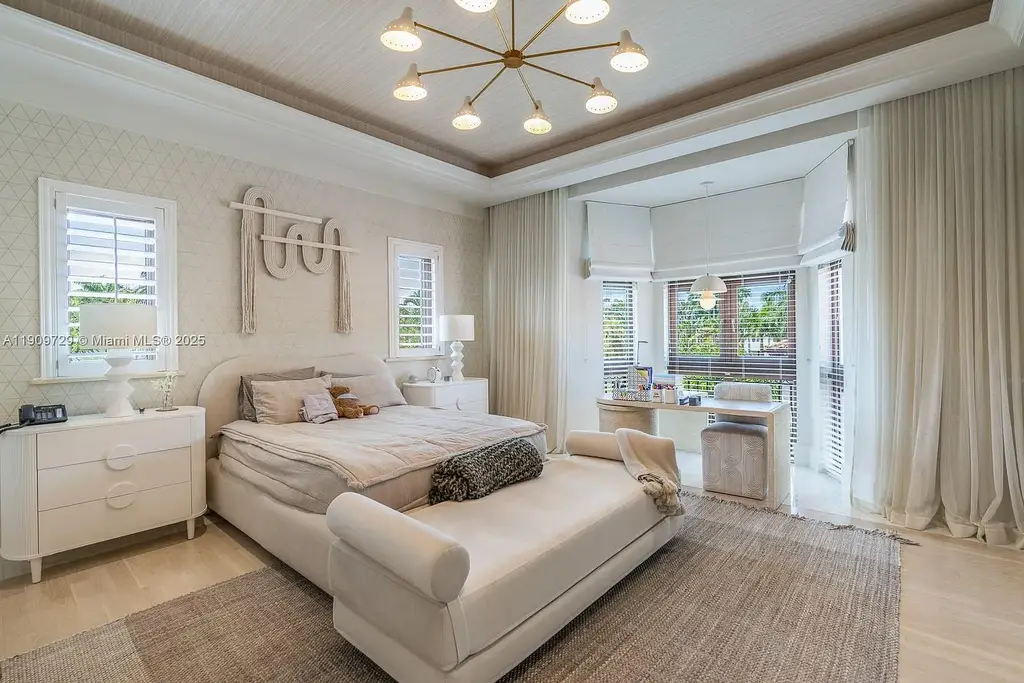 Luxury waterfront estate at 210 Palm Ave Miami Beach with infinity pool, private dock, modern finishes, and panoramic bay views