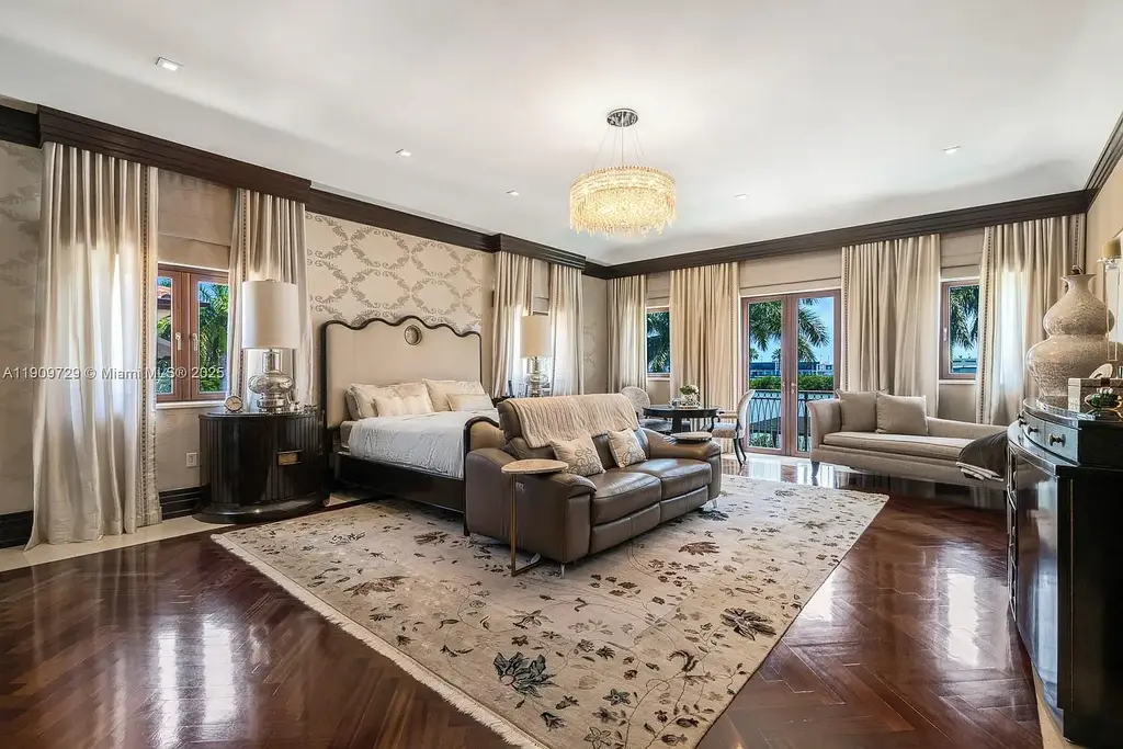 Luxury waterfront estate at 210 Palm Ave Miami Beach with infinity pool, private dock, modern finishes, and panoramic bay views