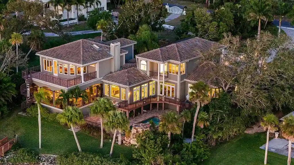 Aerial view of luxurious Nokomis Home for sale with deep-water dock and bay access