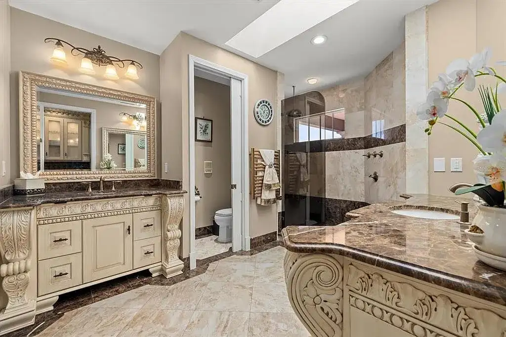 Aerial view of luxurious Nokomis Home for sale with deep-water dock and bay access