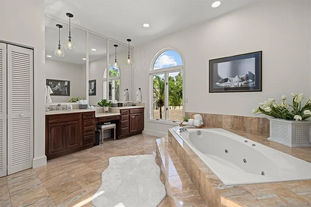 Aerial view of luxurious Nokomis Home for sale with deep-water dock and bay access