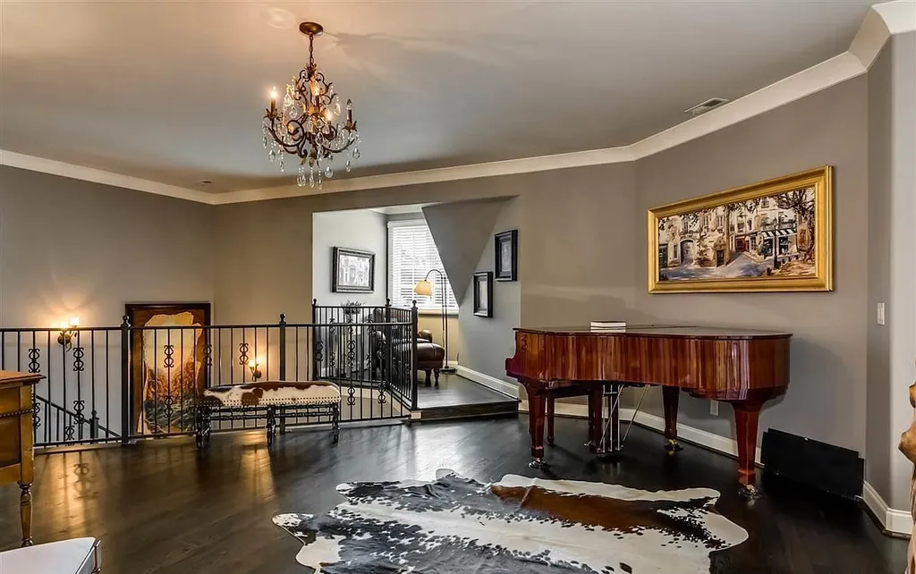 Elegant music room at 2470 Cahaba Valley Rd, Indian Springs, Alabama, featuring a grand piano, chandelier lighting, and refined décor, highlighted in Luxury Houses Magazine.