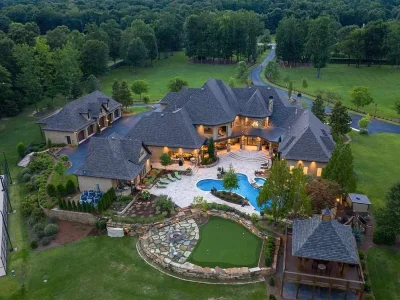 A Majestic Home in Indian Springs – The Quintessential Alabama Estate at 2470 Cahaba Valley Rd 4 Aerial view of the luxury estate at 2470 Cahaba Valley Rd in Indian Springs, Alabama — featuring a grand transitional-style home surrounded by lush 41-acre grounds, a heated pool, putting green, and guest pavilion, as showcased in Luxury Houses Magazine.