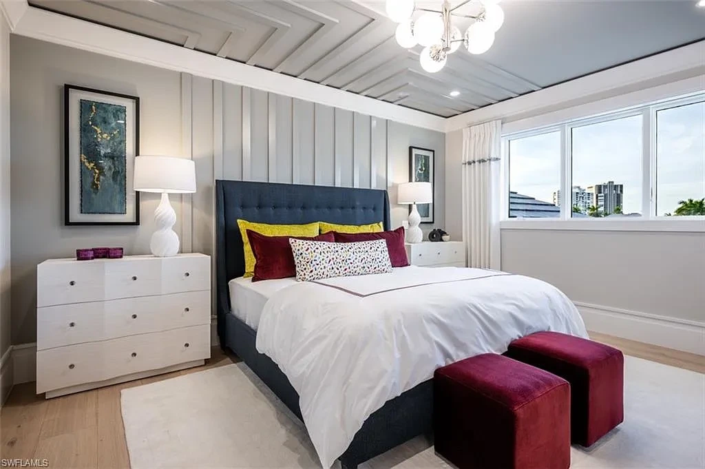 405 NEAPOLITAN WAY Naples FL luxury waterfront home featuring 5 bedrooms, 7 bathrooms, resort-style pool, outdoor kitchen, and panoramic bay views.