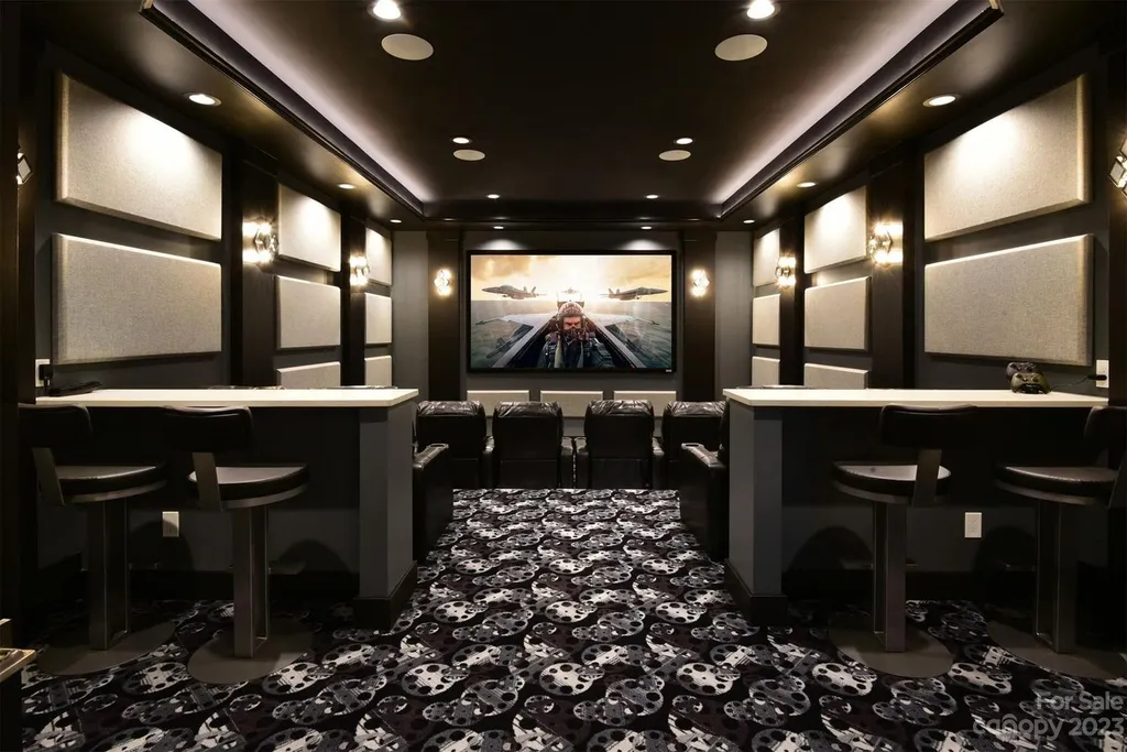 A Breathtaking Modern Masterpiece Overlooking Lake Tillery, North Carolina 7 Home theater at 4059 Old Timber Way, Norwood, North Carolina, featuring surround sound, tiered seating, acoustic panels, and luxury cinema design.