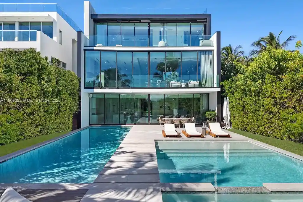 $40 Million Oceanfront Miami Beach Estate with Rooftop Terrace and Saltwater Pool 16 Oceanfront primary suite at 7845 Atlantic Way featuring private terrace, spa bath, and panoramic Atlantic views
