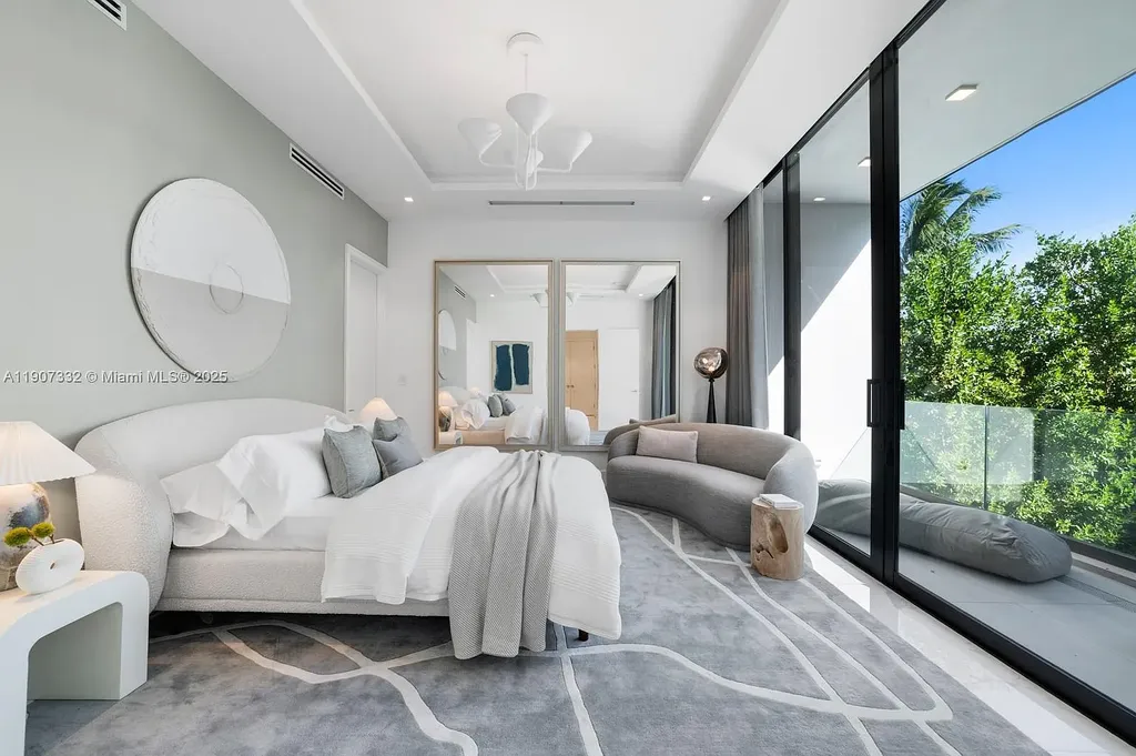 $40 Million Oceanfront Miami Beach Estate with Rooftop Terrace and Saltwater Pool 13 Oceanfront primary suite at 7845 Atlantic Way featuring private terrace, spa bath, and panoramic Atlantic views