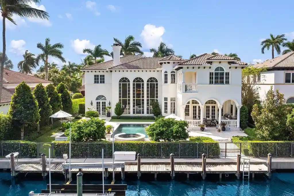 853 Harbour Isle Place luxury waterfront estate in North Palm Beach Florida featuring 5 bedrooms 7 bathrooms 7169 sq ft with private deep-water dock and resort-style pool