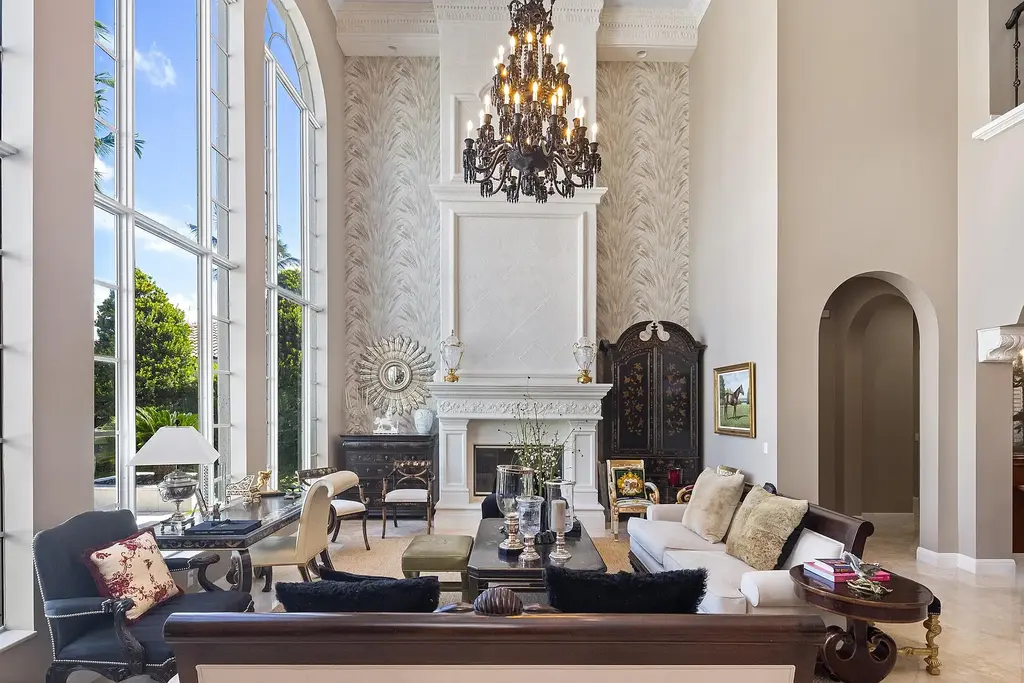 853 Harbour Isle Place luxury waterfront estate in North Palm Beach Florida featuring 5 bedrooms 7 bathrooms 7169 sq ft with private deep-water dock and resort-style pool