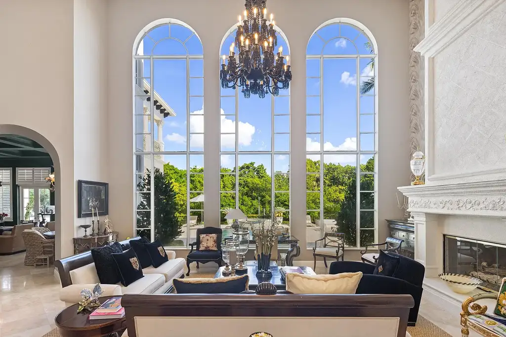 853 Harbour Isle Place luxury waterfront estate in North Palm Beach Florida featuring 5 bedrooms 7 bathrooms 7169 sq ft with private deep-water dock and resort-style pool