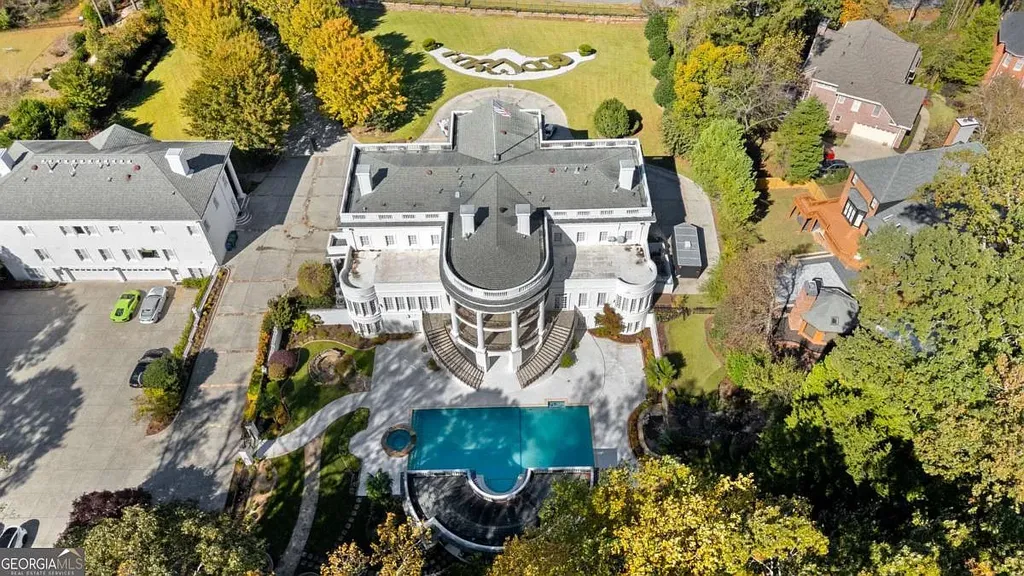 Full aerial view of the Atlanta White House dual estate, showing the main mansion, separate West Wing guest house, pool area, and the 2.67-acre property layout.