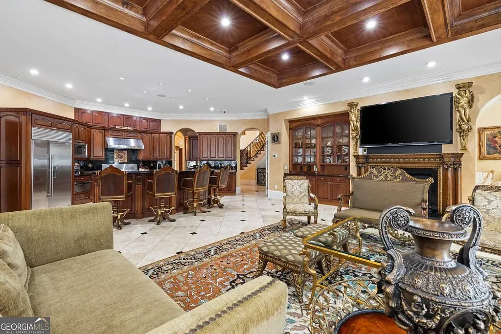 The luxurious open-concept family room and wet bar area in the Atlanta White House, featuring rich wood coffered ceilings, marble floors, and elaborate classical furniture.