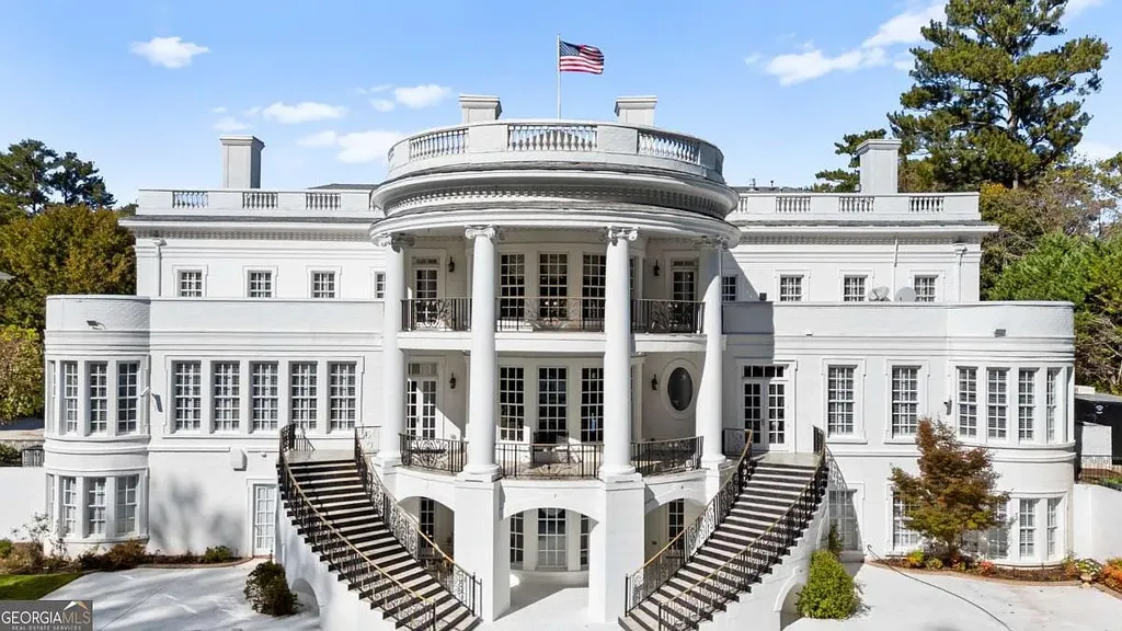 Close-up view of the rear elevation of the $35M Atlanta White House, featuring the grand semicircular portico, double stacked balconies, and twin staircases.