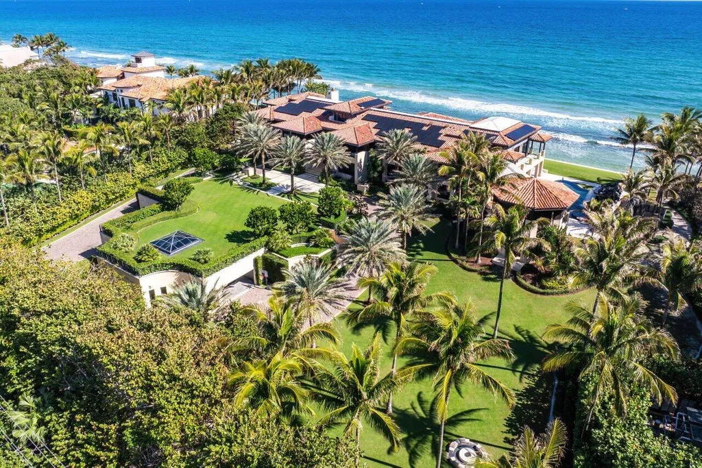 The 5 Biggest Houses in Florida and Their Insane Amenities (2025 Ultimate List) 5 Aerial view of The Modern Balinese Estate at 1370 S Ocean Blvd, Manalapan, showing the tropical compound, expansive lawn, and private beach access.