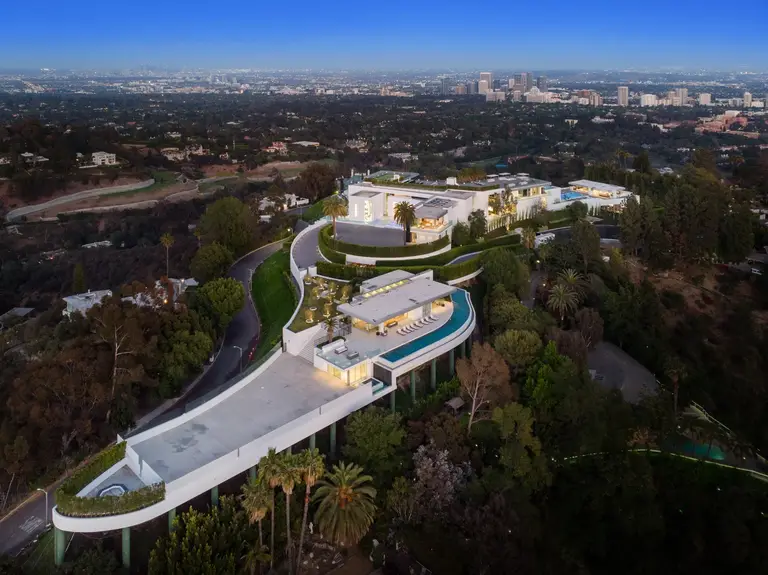 An expansive aerial view of The One, the biggest home in Los Angeles, showcasing its modern architecture, multiple levels, and extensive grounds in Bel Air