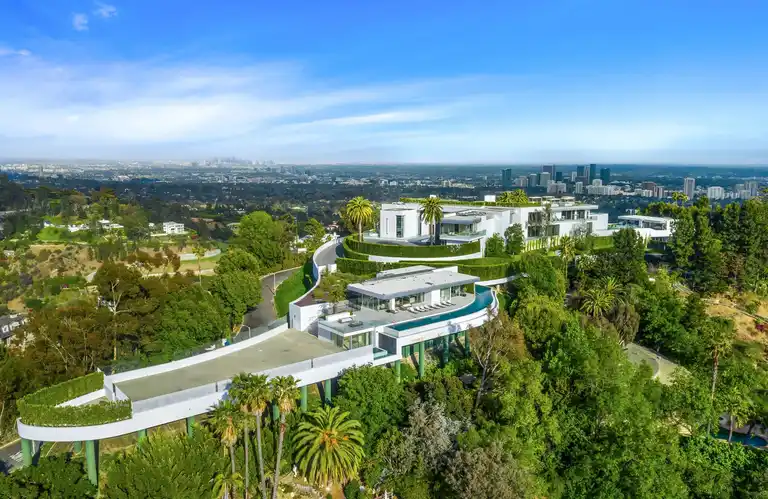 The One, the biggest home in Los Angeles, positioned on a Bel Air hilltop with spectacular panoramic views of the city skyline and surrounding luxury landscape.