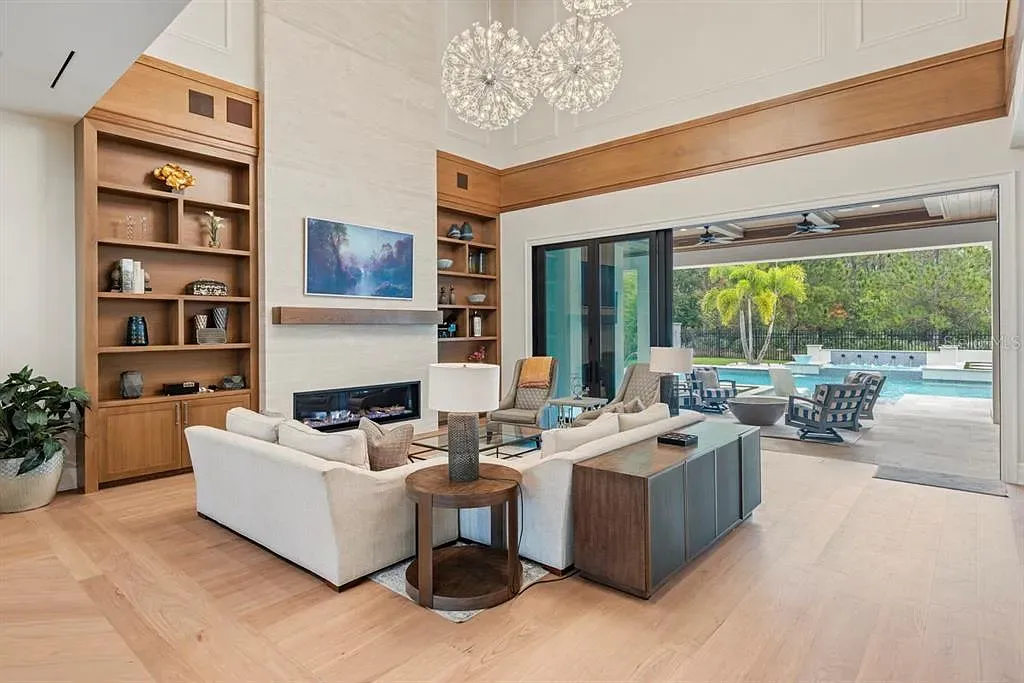 Stunning Ultra Luxury Estate Listed at $12.8 Million in Four Seasons Golden Oak Orlando 7 Interior view of 10273 Summer Meadow Way Orlando FL showing open-plan living area with high ceilings and natural light