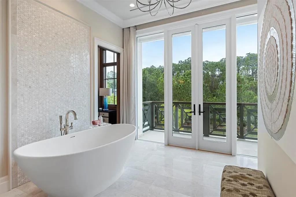 Stunning Ultra Luxury Estate Listed at $12.8 Million in Four Seasons Golden Oak Orlando 14 Interior view of 10273 Summer Meadow Way Orlando FL showing open-plan living area with high ceilings and natural light