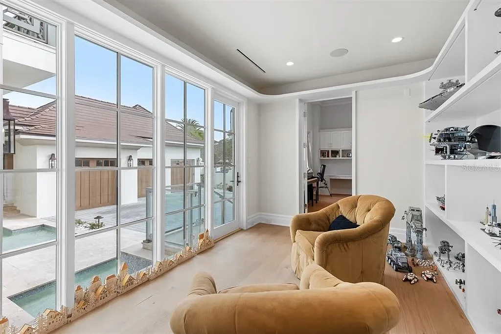 Stunning Ultra Luxury Estate Listed at $12.8 Million in Four Seasons Golden Oak Orlando 16 Interior view of 10273 Summer Meadow Way Orlando FL showing open-plan living area with high ceilings and natural light