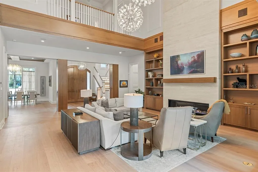 Stunning Ultra Luxury Estate Listed at $12.8 Million in Four Seasons Golden Oak Orlando 8 Interior view of 10273 Summer Meadow Way Orlando FL showing open-plan living area with high ceilings and natural light