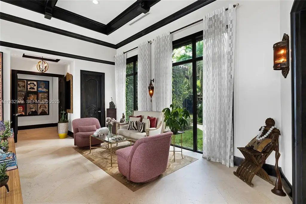 $34.5 Million Waterfront Estate Redefines Quiet Luxury in Bay Harbor Islands 12 Waterfront view of 10330 W Broadview Dr, a luxury home in Bay Harbor Islands for sale, featuring a Mediterranean-style design with open bay and Intracoastal views.