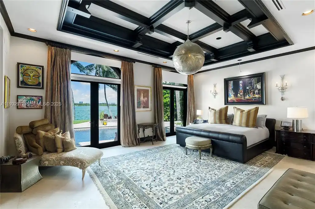 $34.5 Million Waterfront Estate Redefines Quiet Luxury in Bay Harbor Islands 13 Waterfront view of 10330 W Broadview Dr, a luxury home in Bay Harbor Islands for sale, featuring a Mediterranean-style design with open bay and Intracoastal views.