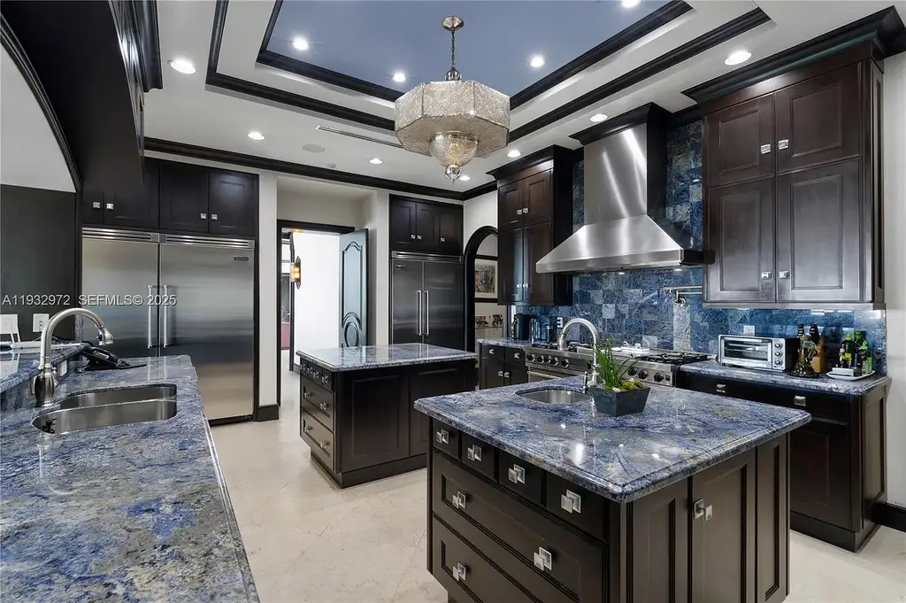 $34.5 Million Waterfront Estate Redefines Quiet Luxury in Bay Harbor Islands 10 Waterfront view of 10330 W Broadview Dr, a luxury home in Bay Harbor Islands for sale, featuring a Mediterranean-style design with open bay and Intracoastal views.