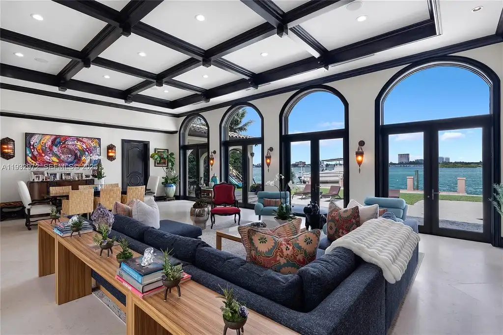 $34.5 Million Waterfront Estate Redefines Quiet Luxury in Bay Harbor Islands 8 Waterfront view of 10330 W Broadview Dr, a luxury home in Bay Harbor Islands for sale, featuring a Mediterranean-style design with open bay and Intracoastal views.