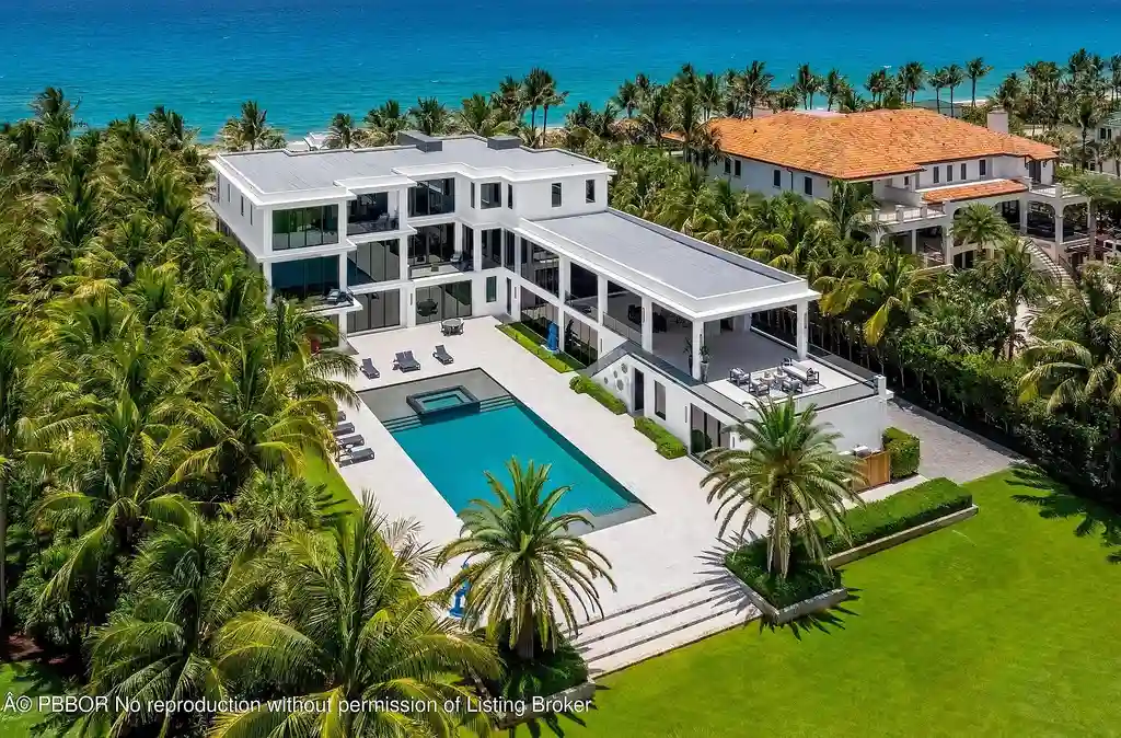 Aerial view of 1660 S Ocean Blvd showing 2.06-acre beachfront estate and private dock