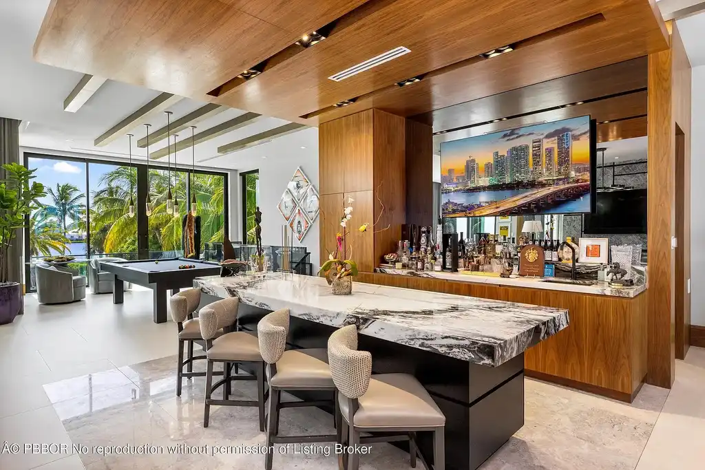 Aerial view of 1660 S Ocean Blvd showing 2.06-acre beachfront estate and private dock