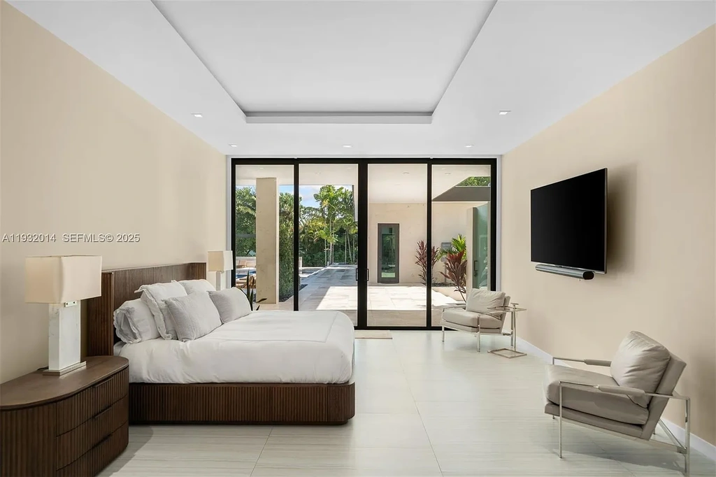 $14.9 Million Modern Estate on 3.36 Acres Redefines Private Luxury Living in Fort Lauderdale 13 Modern luxury estate at 17841 SW 70th Pl in Fort Lauderdale featuring a gated entrance and expansive 3.36-acre lot