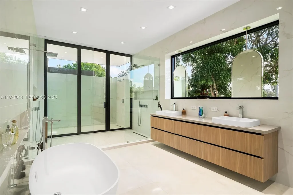 $14.9 Million Modern Estate on 3.36 Acres Redefines Private Luxury Living in Fort Lauderdale 14 Modern luxury estate at 17841 SW 70th Pl in Fort Lauderdale featuring a gated entrance and expansive 3.36-acre lot