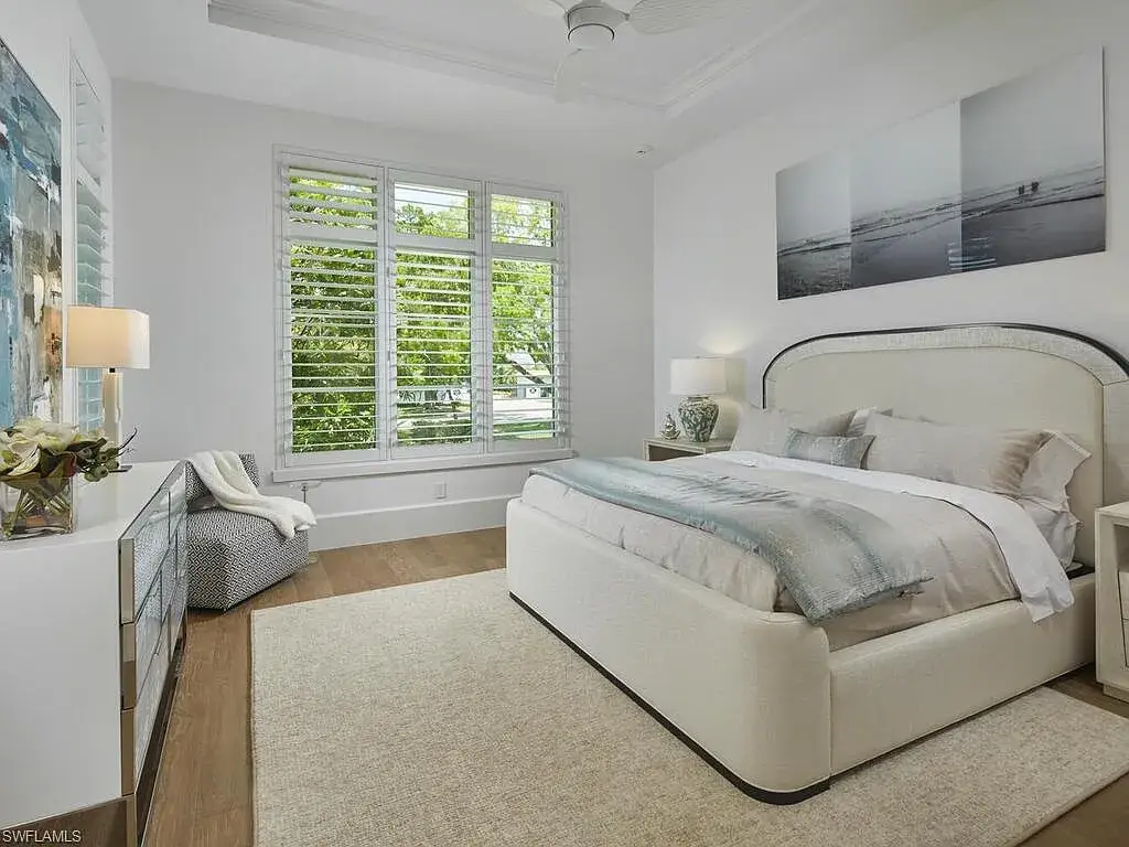 A $19.9 Million Stunning Tropical Contemporary Estate Steps From the Beach in Prestigious Naples 14 Tropical contemporary exterior of 2075 Gordon Dr E in Naples FL featuring a metal roof, stone accents, and lush landscaping near the beach