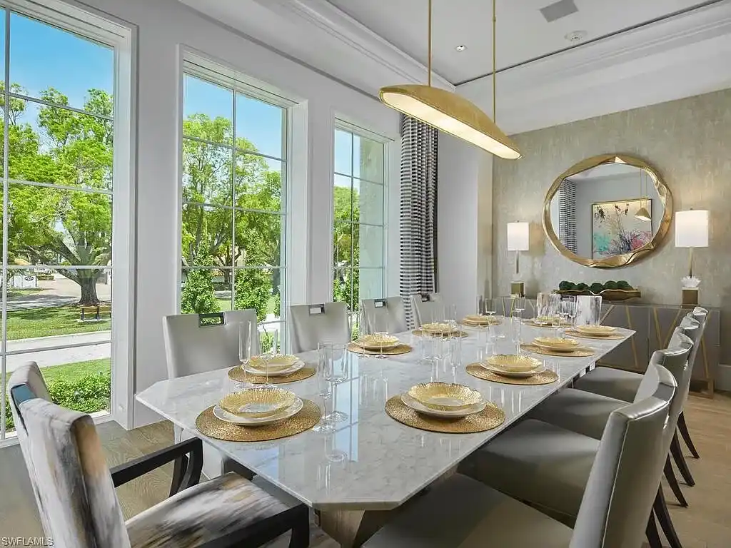 A $19.9 Million Stunning Tropical Contemporary Estate Steps From the Beach in Prestigious Naples 11 Tropical contemporary exterior of 2075 Gordon Dr E in Naples FL featuring a metal roof, stone accents, and lush landscaping near the beach
