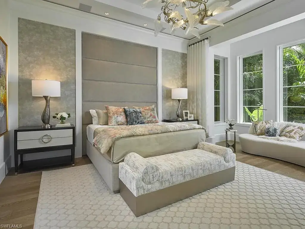 A $19.9 Million Stunning Tropical Contemporary Estate Steps From the Beach in Prestigious Naples 12 Tropical contemporary exterior of 2075 Gordon Dr E in Naples FL featuring a metal roof, stone accents, and lush landscaping near the beach