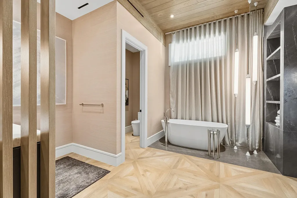 A $25.8 Million Contemporary Masterpiece Redefining Luxury Living Inside Jupiter’s Elite Bear’s Club 13 Luxury home for sale at 210 Bears Club Drive featuring modern design and landscaped grounds