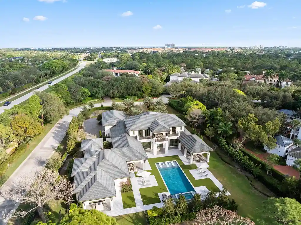 A $25.8 Million Contemporary Masterpiece Redefining Luxury Living Inside Jupiter’s Elite Bear’s Club 17 Luxury home for sale at 210 Bears Club Drive featuring modern design and landscaped grounds