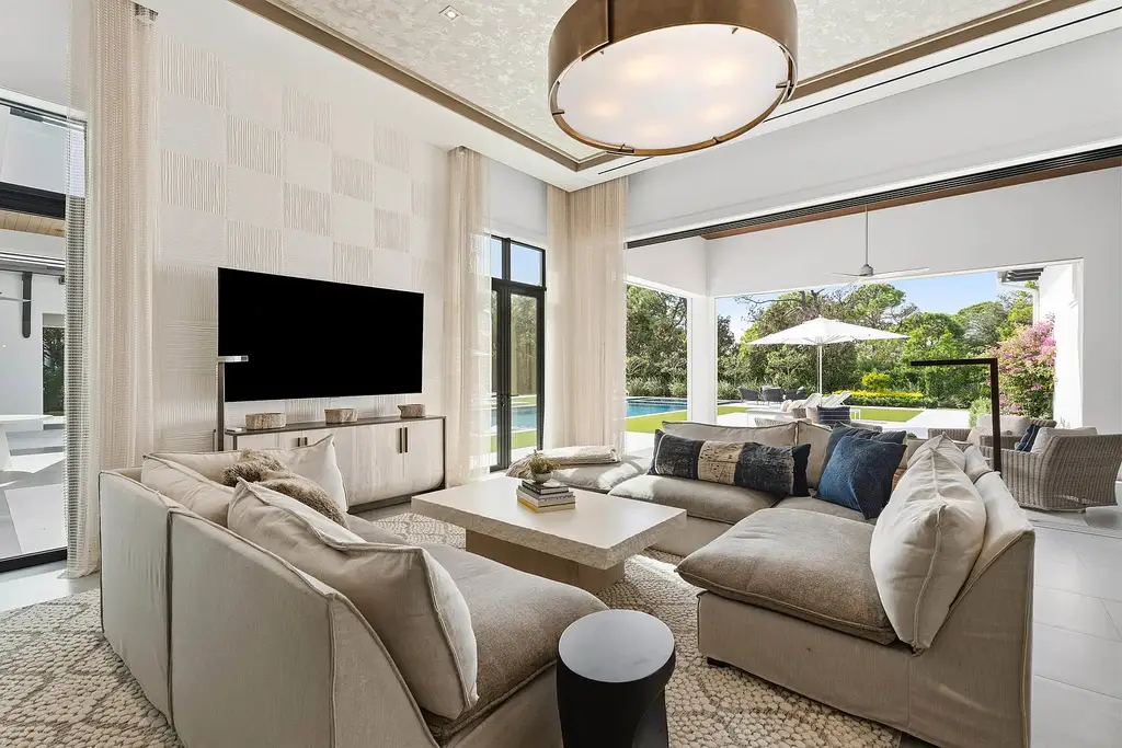 A $25.8 Million Contemporary Masterpiece Redefining Luxury Living Inside Jupiter’s Elite Bear’s Club 10 Luxury home for sale at 210 Bears Club Drive featuring modern design and landscaped grounds