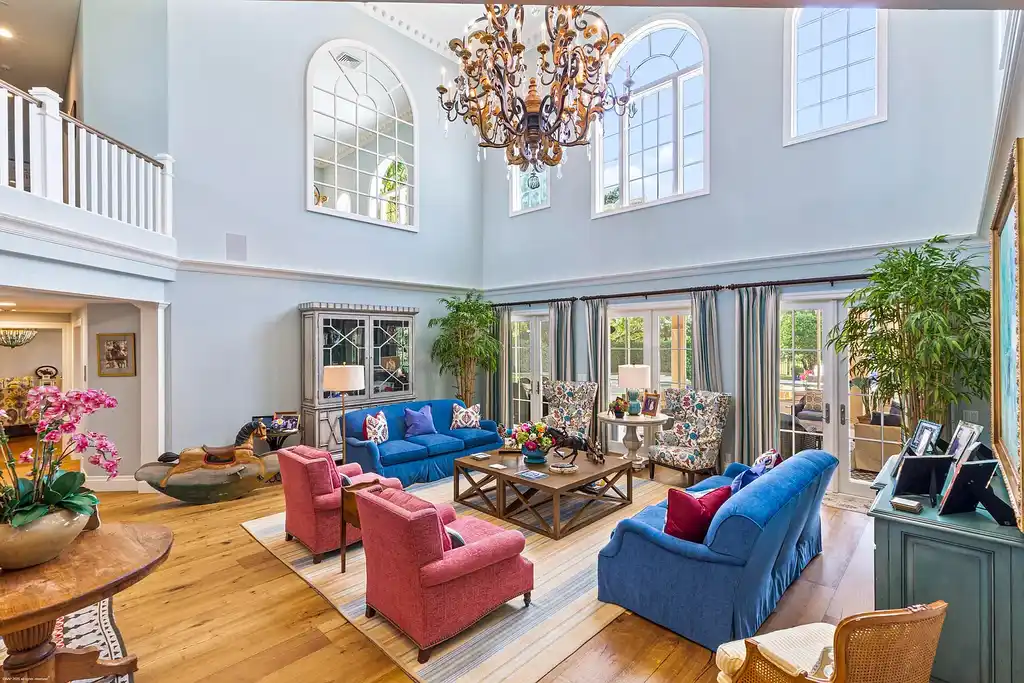 $13.5 Million Luxury Wellington Estate Featuring Private Tennis Court, Pool, and Equestrian Amenities 7 Outdoor pool and cabana at 2359 Muir Circle, Wellington, surrounded by manicured gardens and private tennis court