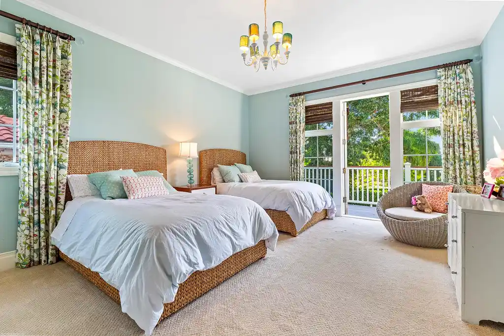 $13.5 Million Luxury Wellington Estate Featuring Private Tennis Court, Pool, and Equestrian Amenities 14 Outdoor pool and cabana at 2359 Muir Circle, Wellington, surrounded by manicured gardens and private tennis court